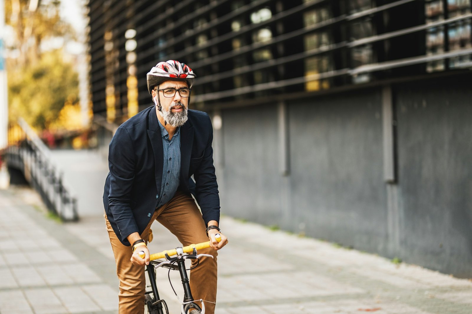 A Businessman Traveling To Work With A Bike